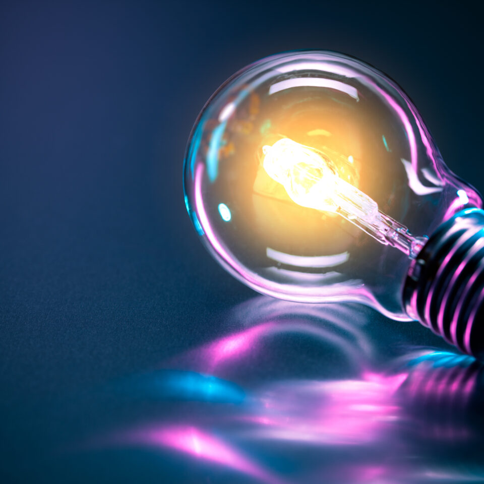 a light bulb on a purple surface