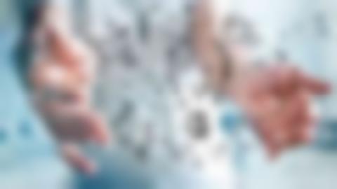 Businessman on blurred background holding Communications with his hand